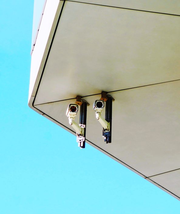 low-angle-view-security-camera-against-clear-blue-sky